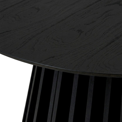 Close-up of dark wood tabletop edge and slatted base detail