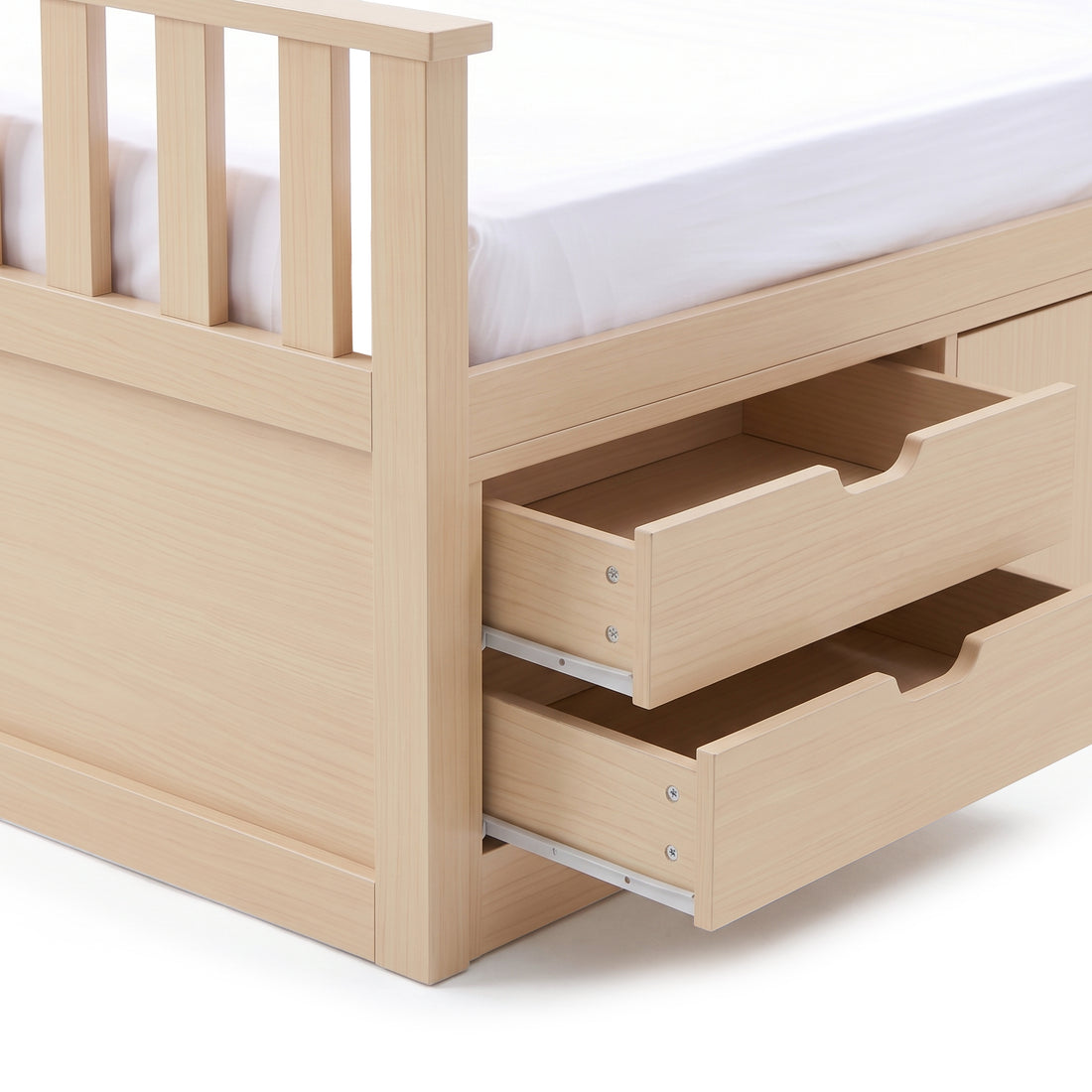Close-up of wooden bed frame corner with open storage drawers on a white background
