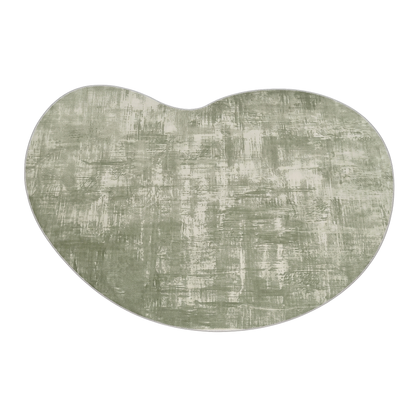 Kidney-shaped muted green and white abstract patterned rug or mat on a white background