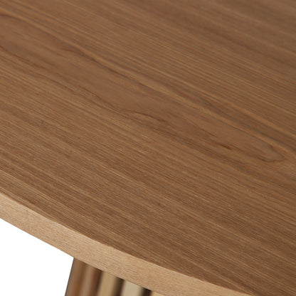 Close-up of the Riri 120cm Round Fluted Wood Dining Table in Oak, showcasing its natural grain and curved edge. Partial view of fluted base supports, highlighting its sculptural and practical design.