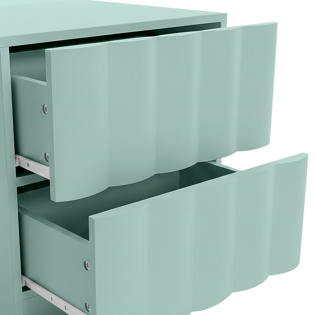 Close-up of mint green cabinet drawers with wavy front on white background