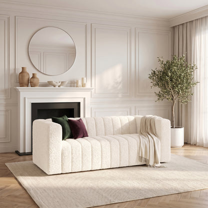 Cream sofa styled in a modern living room