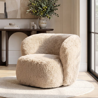 Beige plush accent chair styled in a living room corner