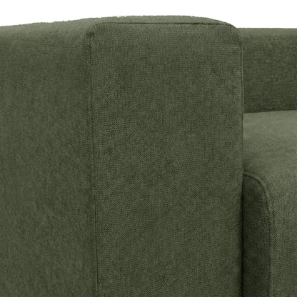 Close-up of dark green sofa armrest and seat cushion on white background