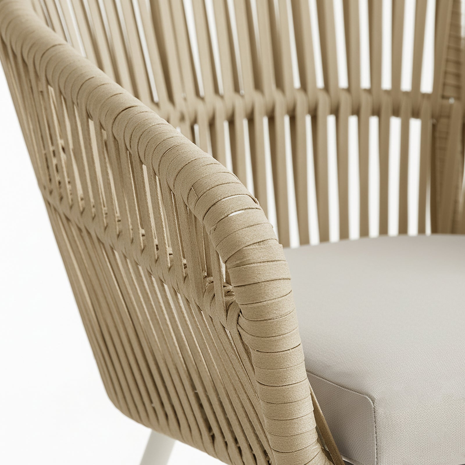 Close-up of the Marula Rope Outdoor Dining Chairs in White Set of 4, showcasing beige rope-wrapped armrests and a light-gray upholstered seat cushion, highlighting the chair's modern design and supportive structure.
