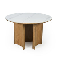 Round table with white marble-like top and wooden pedestal base on a white background