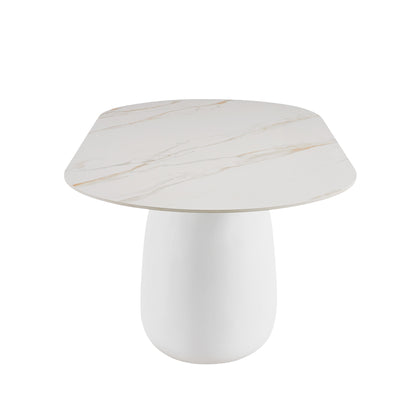 Modern table with rounded square marble-look top and white pedestal base on a white background
