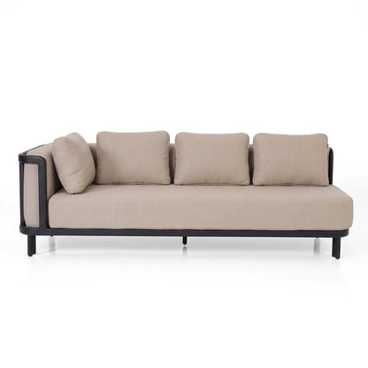 Modern beige sofa with cushions on white background.
