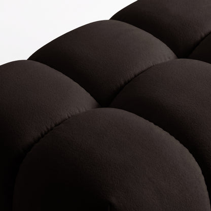 Close-up of chocolate brown upholstered fabric and stitching on a white background.