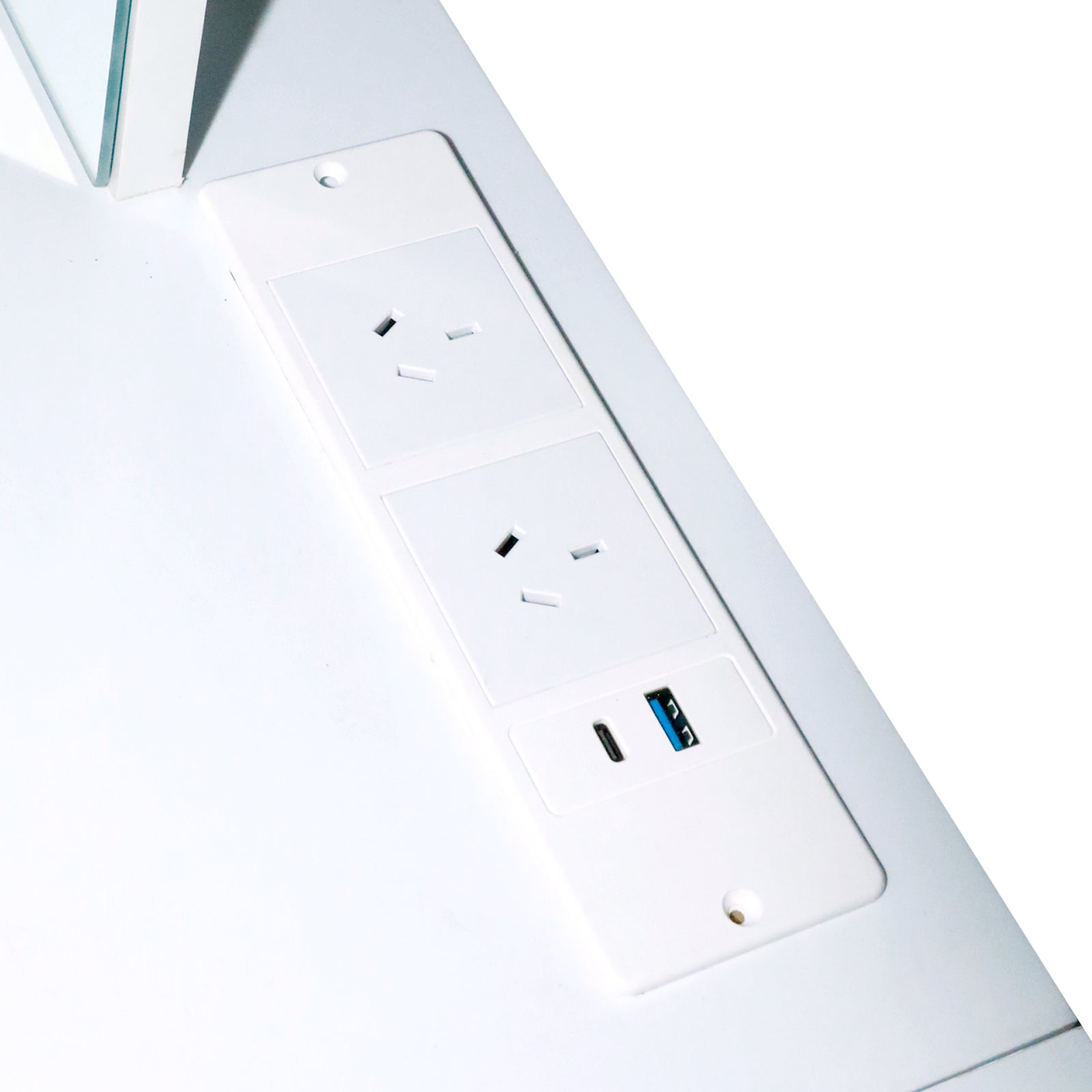 Close-up of three power outlets and USB ports on white surface