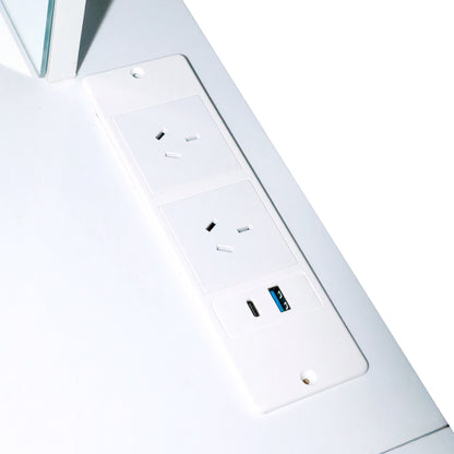 Close-up of three power outlets and USB ports on white surface