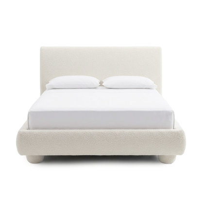 Front view of an upholstered bed on a white background