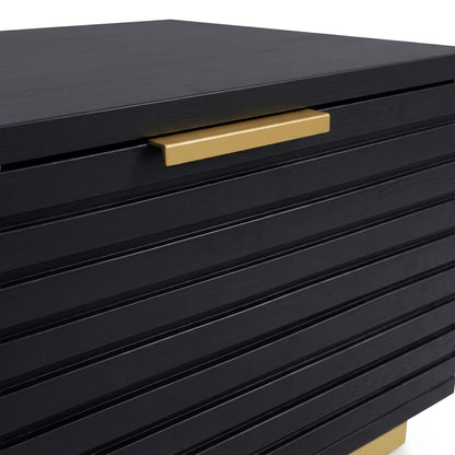 Cropped view of black grooved furniture with gold handle on white background