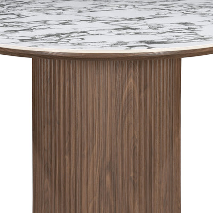 Close view of a round table base with marble-look top on white background