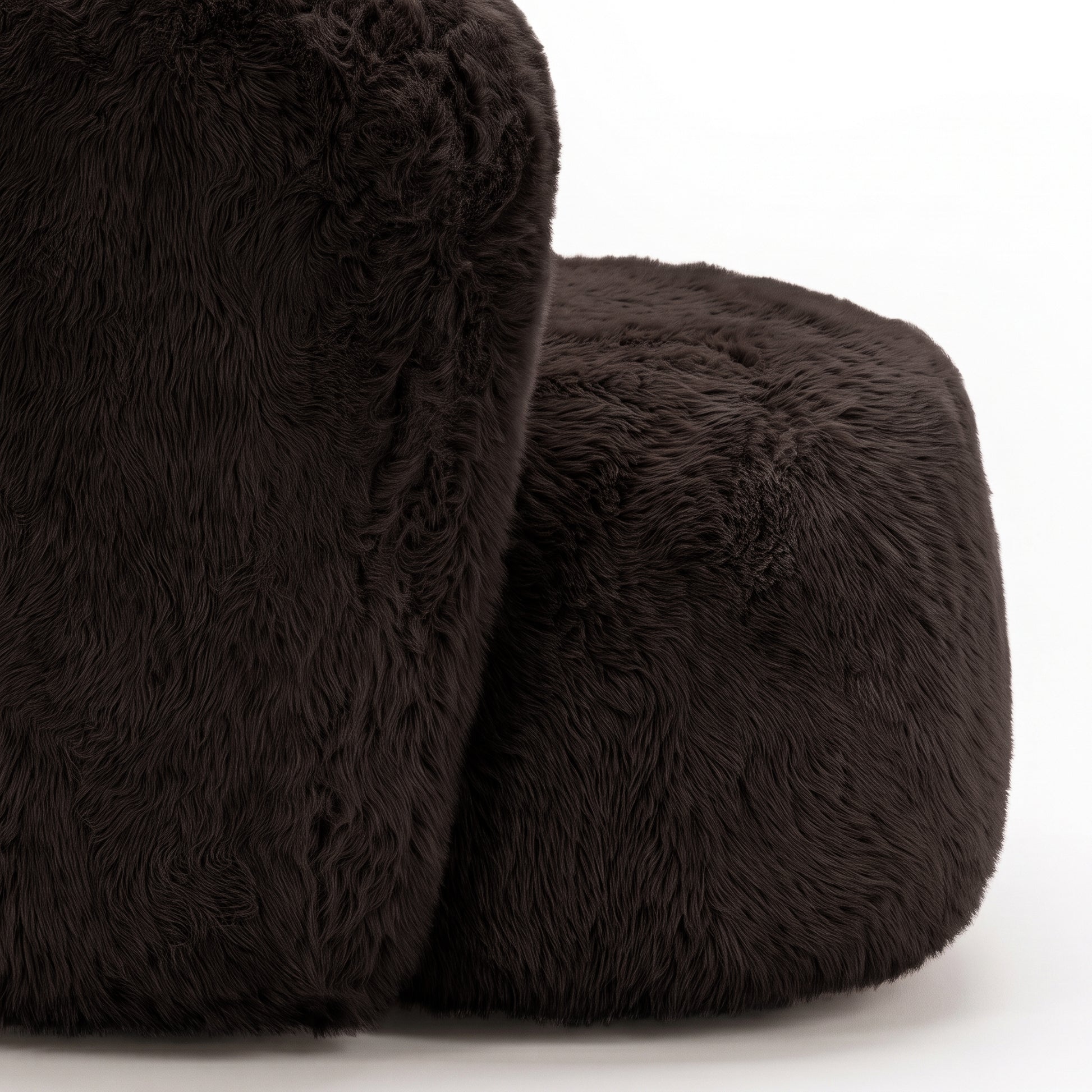 Close-up of plush chocolate brown fuzzy material on a white background