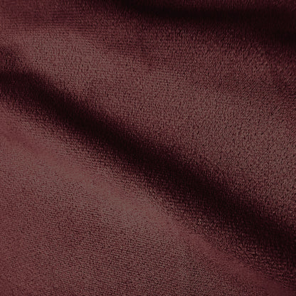 Close-up of burgundy sofa fabric texture.