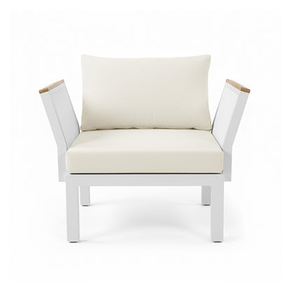Sierra Outdoor Lounge Set in Beige: A modern single-seat chair with a square white metal frame, angled armrests with wood accents, and cream cushions, epitomizing relaxed resort style.