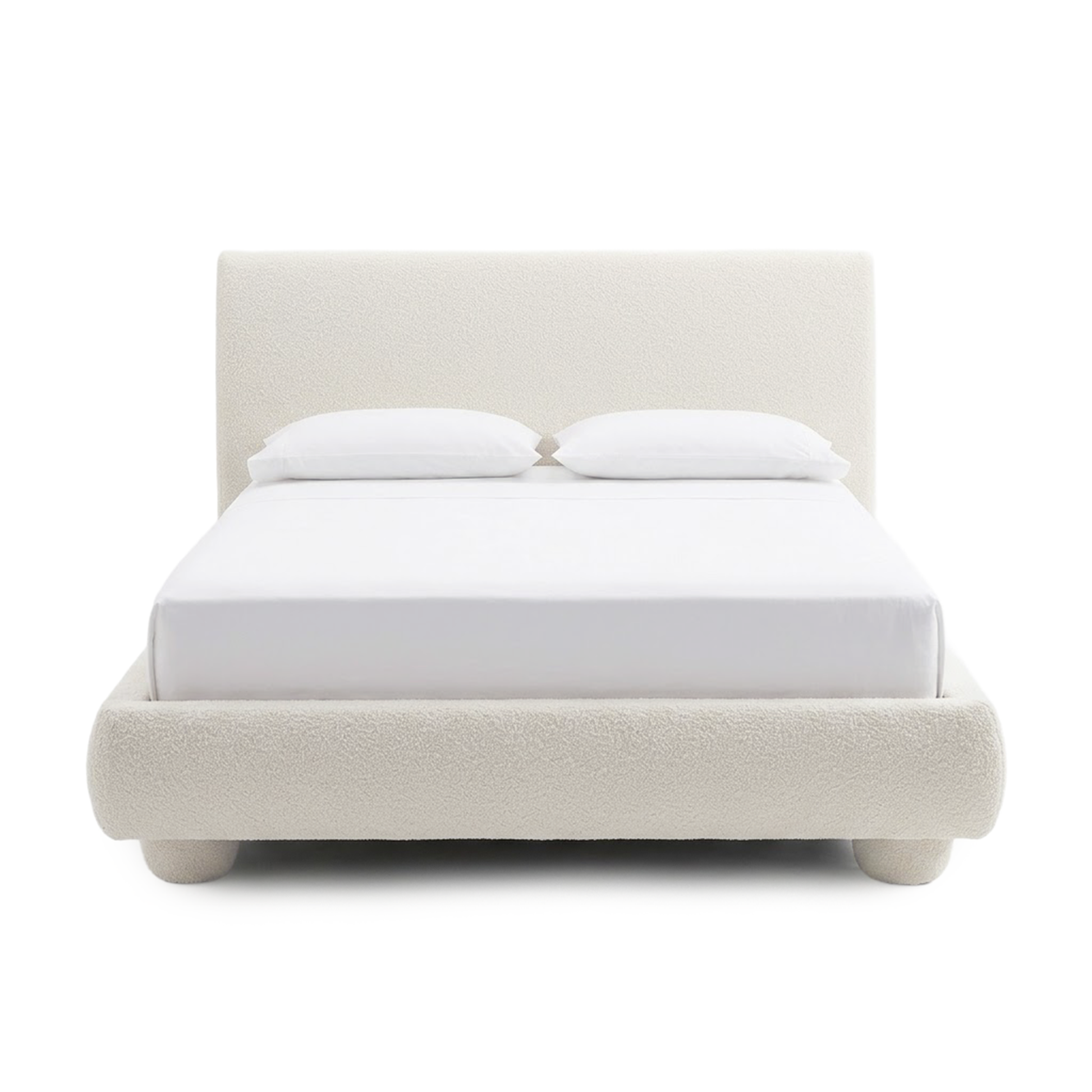 Full upholstered bed with pillows on a white background