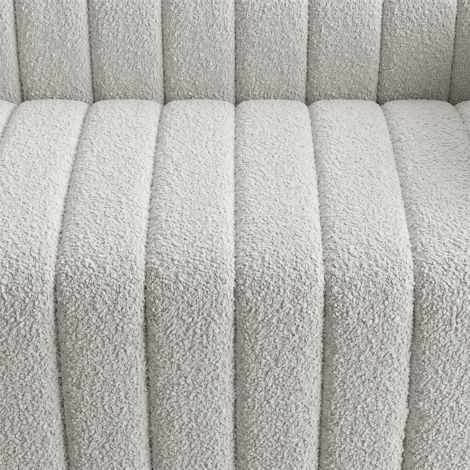 Close-up of light textured upholstered fabric with channel stitching