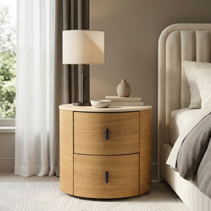 Round wooden nightstand styled beside a bed in a modern bedroom