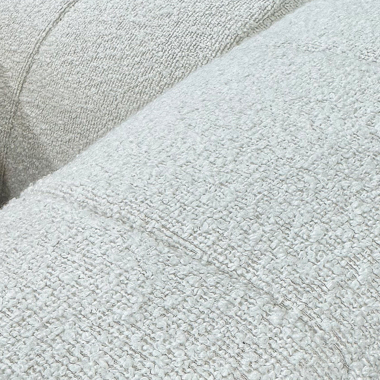 Close-up of the Parisa 4 Seater Tufted Boucle Sofa with Chaise, showcasing its cream white, looped-yarn bouclé upholstery, highlighting the plush texture and cozy seating surface.