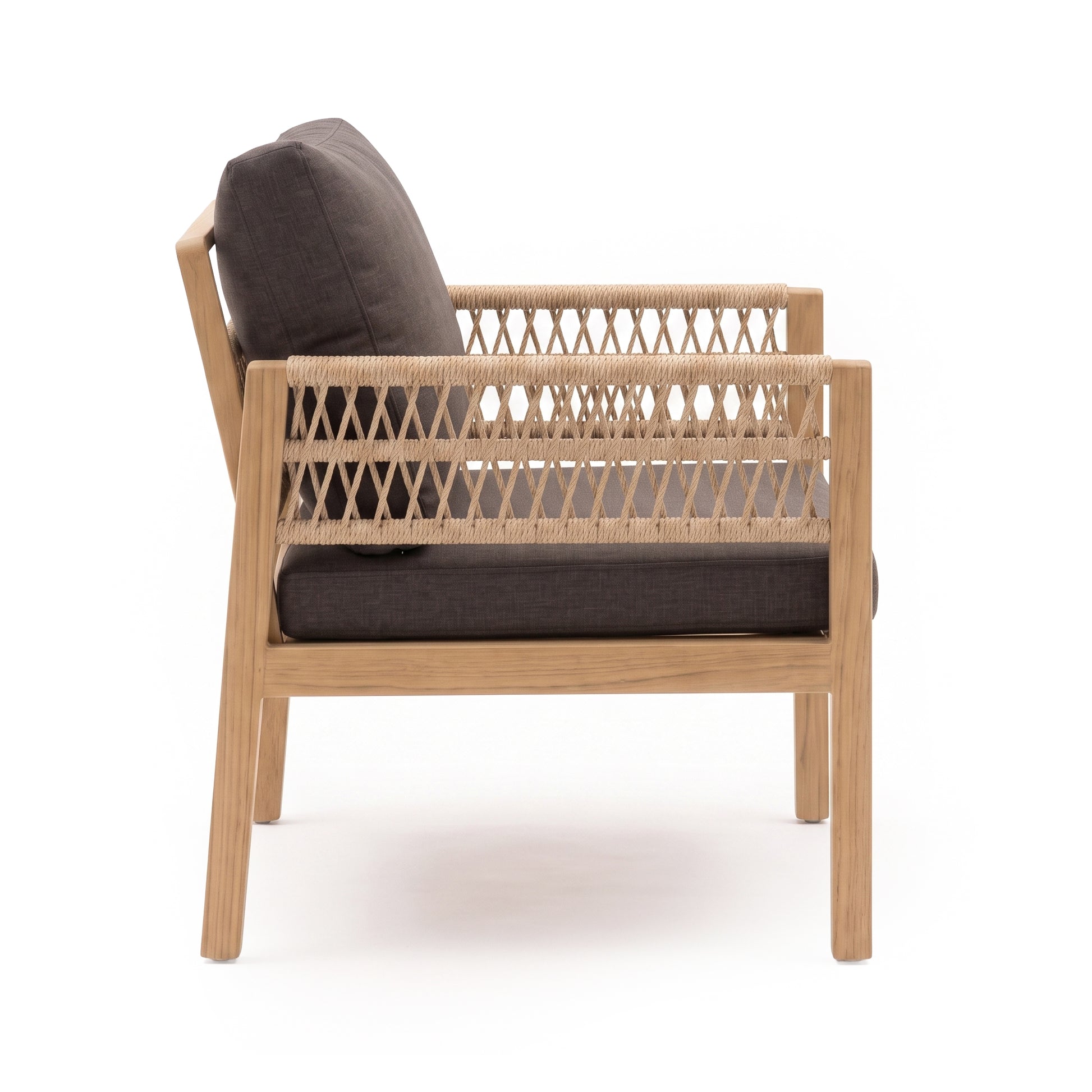 Side view of modern lounge chair with woven side panels and dark cushions on white background