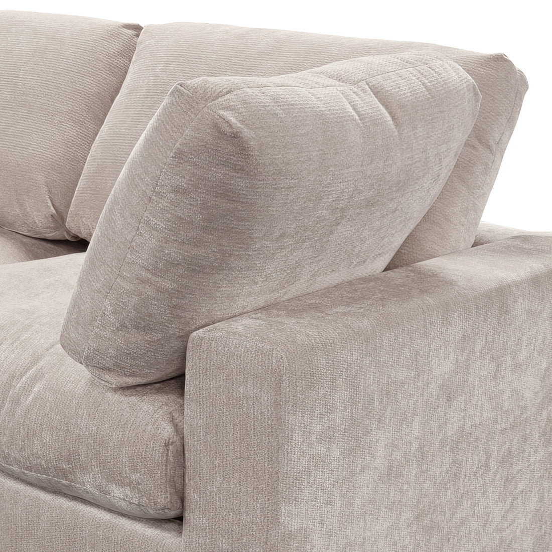 Close-up of a beige fabric sofa section showing armrest, seat cushion, and back cushion.
