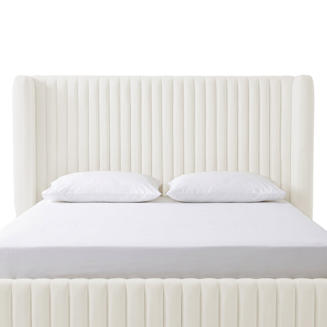 Front-facing cream upholstered bed with tall channel-tufted headboard