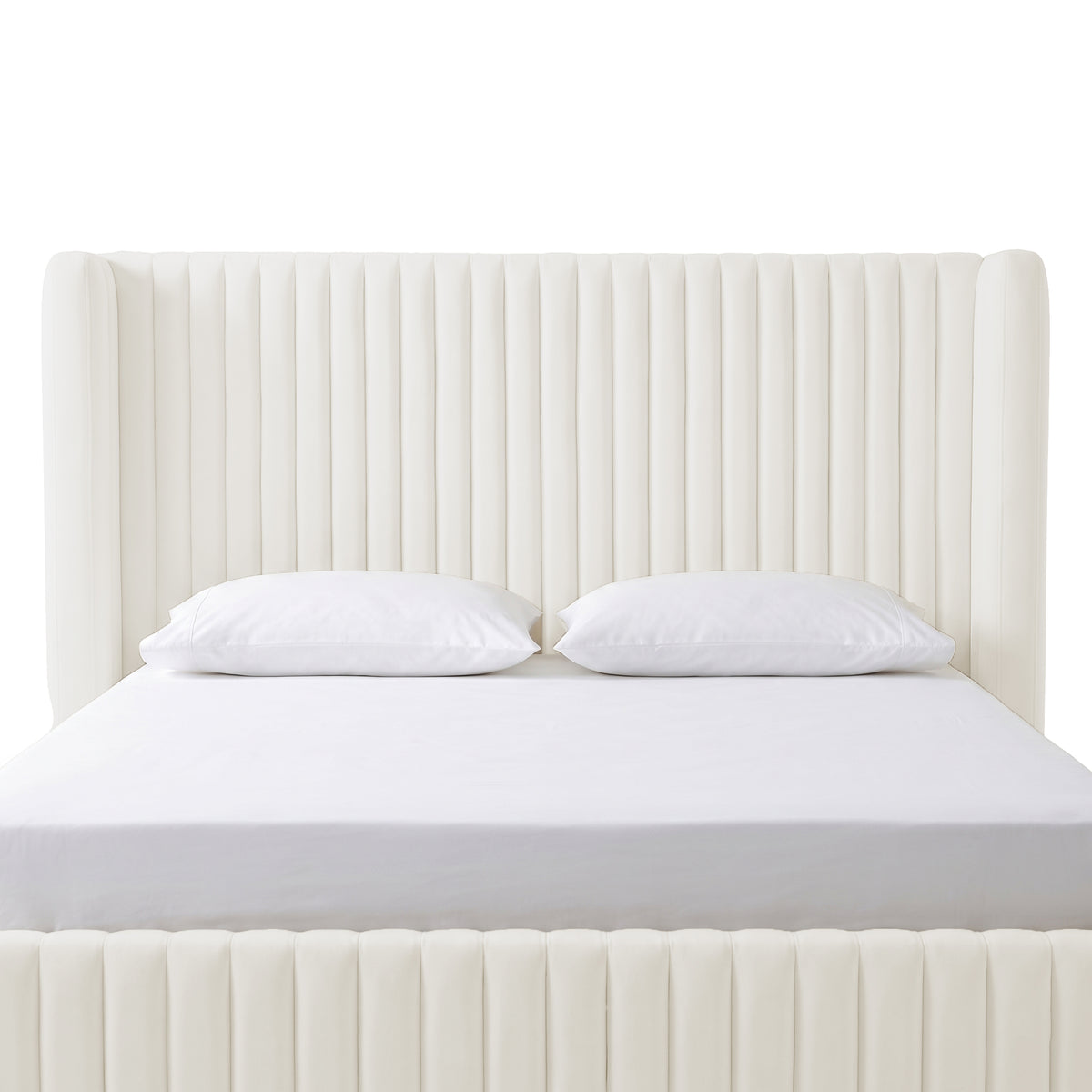 Front-facing cream upholstered bed with tall channel-tufted headboard