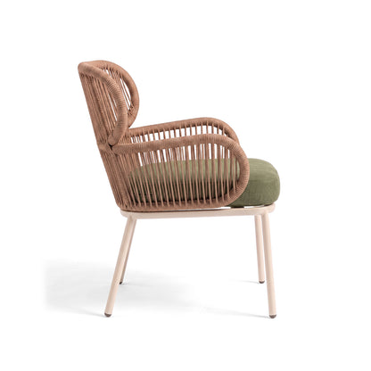 Side view of a woven chair with green cushion on a white background