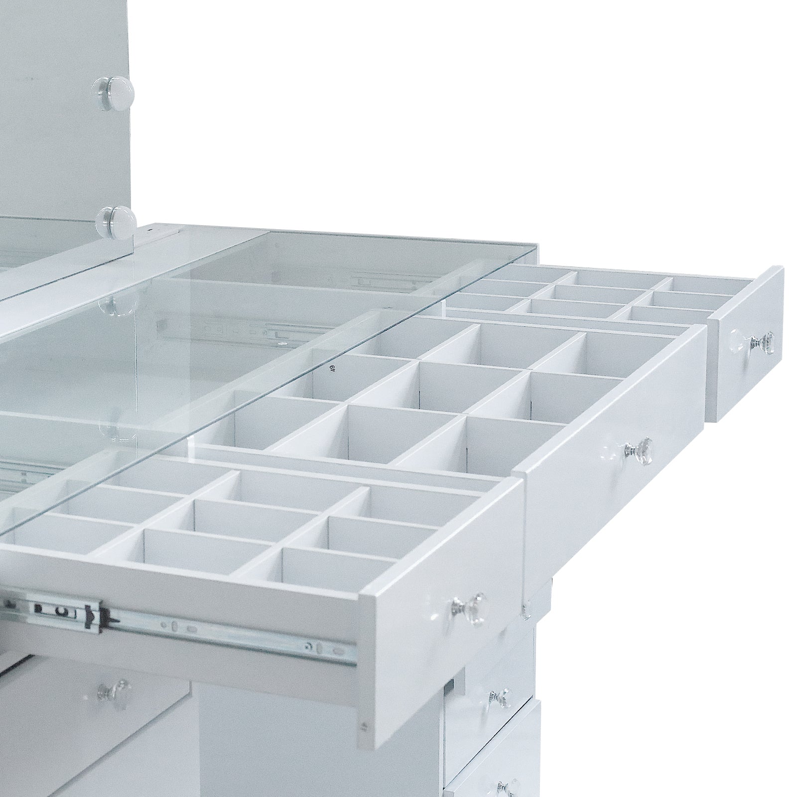 Close-up of vanity drawer compartments on white background