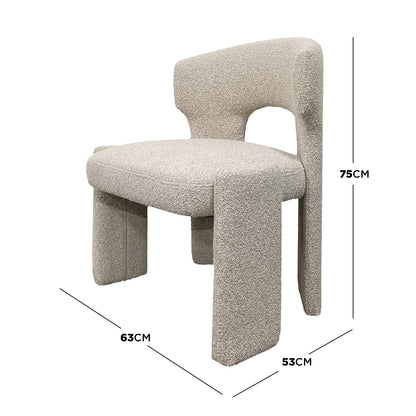 Lunari Bouclé Curved Accent Chair in Beige, featuring a sculptural design with a U-shaped backrest cutout, plush boucle upholstery, and block-style legs, offering compact comfort and modern elegance.