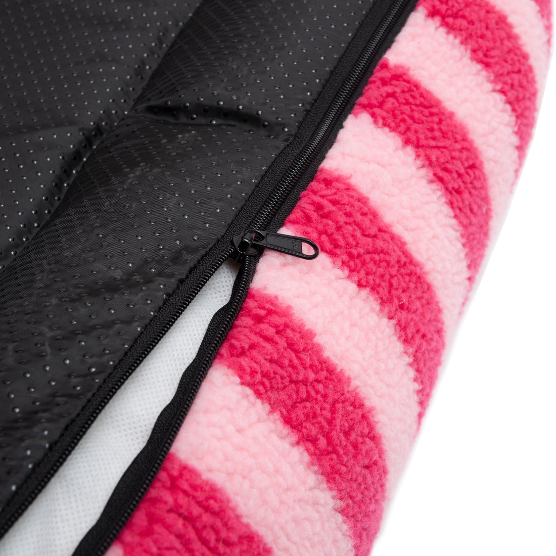 Close-up of black zipper and pink striped plush fabric detail on a white background