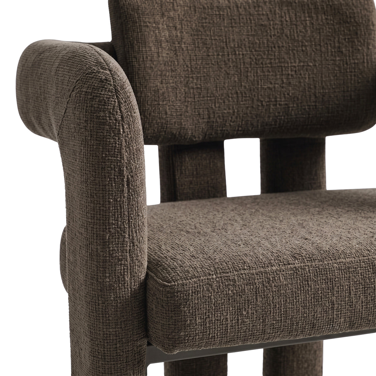 Close-up of the upper portion of a dark brown upholstered chair on a white background