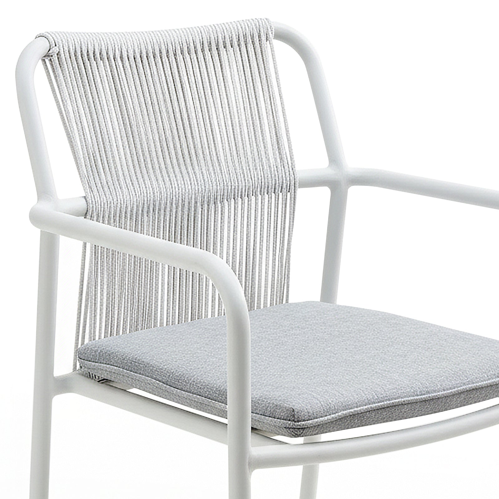 Modern armchair with white metal frame and tightly strung white cord backrest, featuring a removable light-gray cushion. Describes the Evone 4 Seater Stone Outdoor Dining Table Set in Light Grey, highlighting its sleek design.