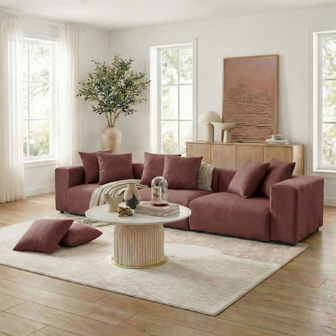 Brown sectional sofa with throw and pillows in a bright living room setting
