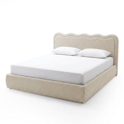 Upholstered bed frame with wavy scalloped headboard on white background