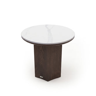 Round side table with white marble top and dark wood pedestal base on a white background