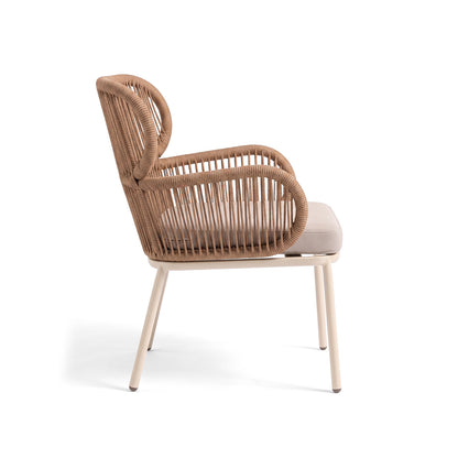 Side view of a woven armchair on a white background
