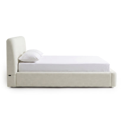 Contemporary upholstered bed shown in side profile on a white background