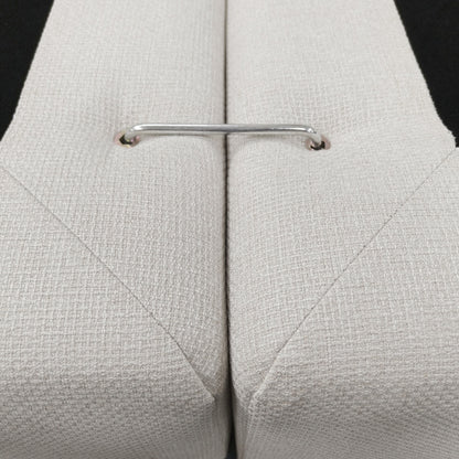 Close-up of upholstered furniture connection bracket and fabric texture