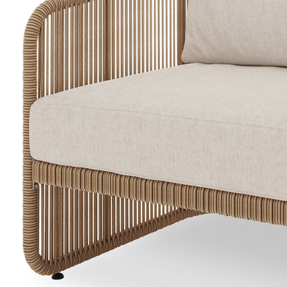 Close-up of the Solari 4 Seater Wicker Outdoor Sofa Set in Natural, featuring a tubular frame wrapped in rope and topped with a thick, upholstered cushion for cozy lounging.