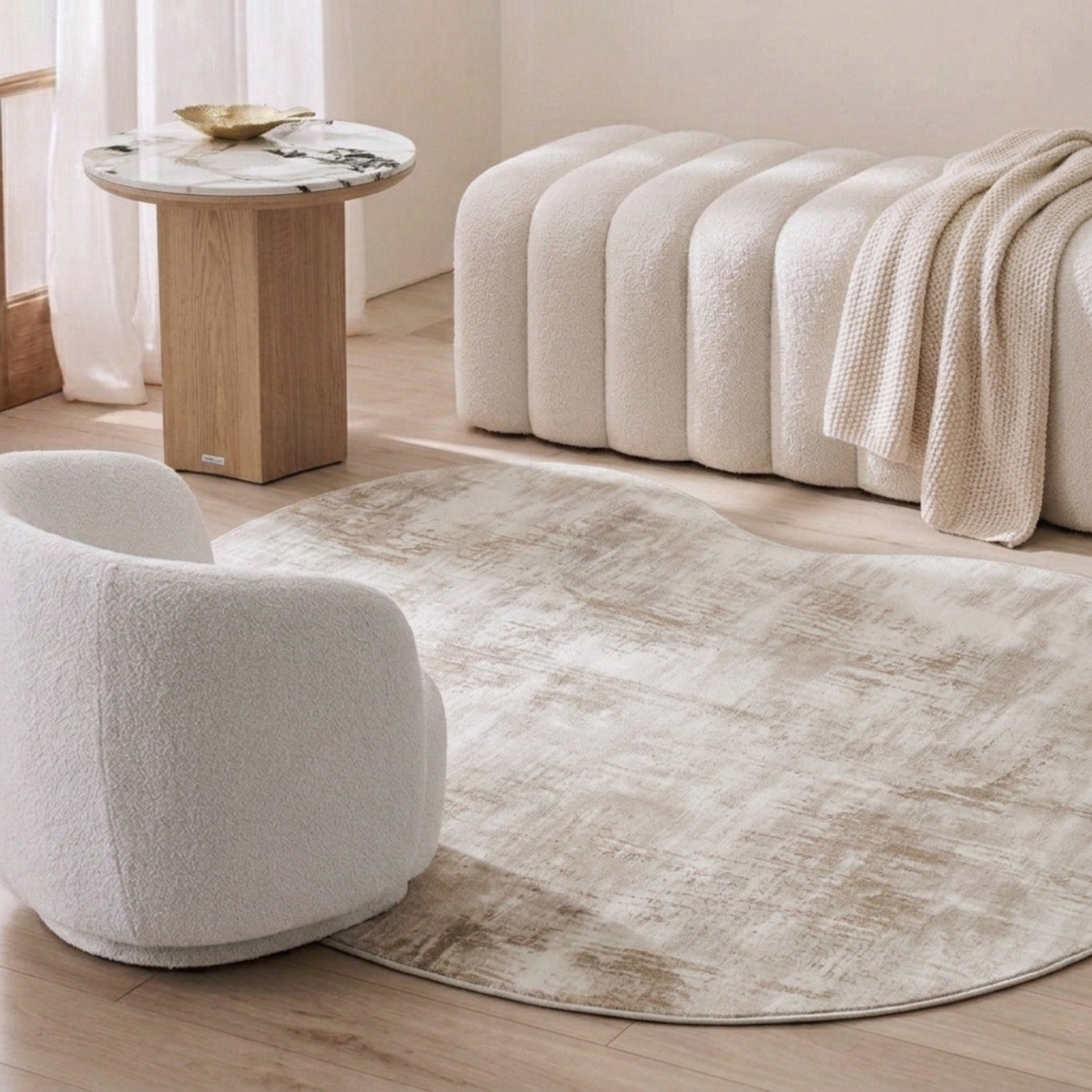 Lifestyle room scene featuring neutral furniture and a rug in a modern living room corner