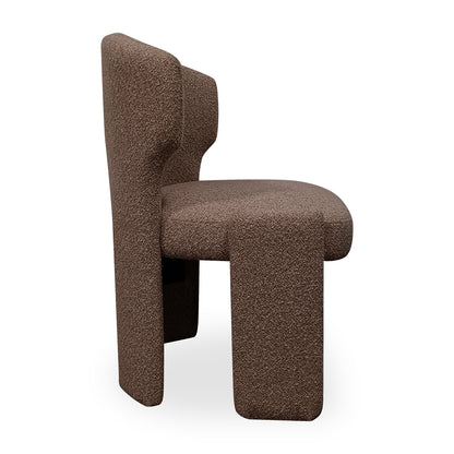Lunari Bouclé Curved Accent Chair in Brown, showcasing a modern, geometric silhouette with block legs, thick padded seat, and slightly curved backrest, all enveloped in textured bouclé fabric.