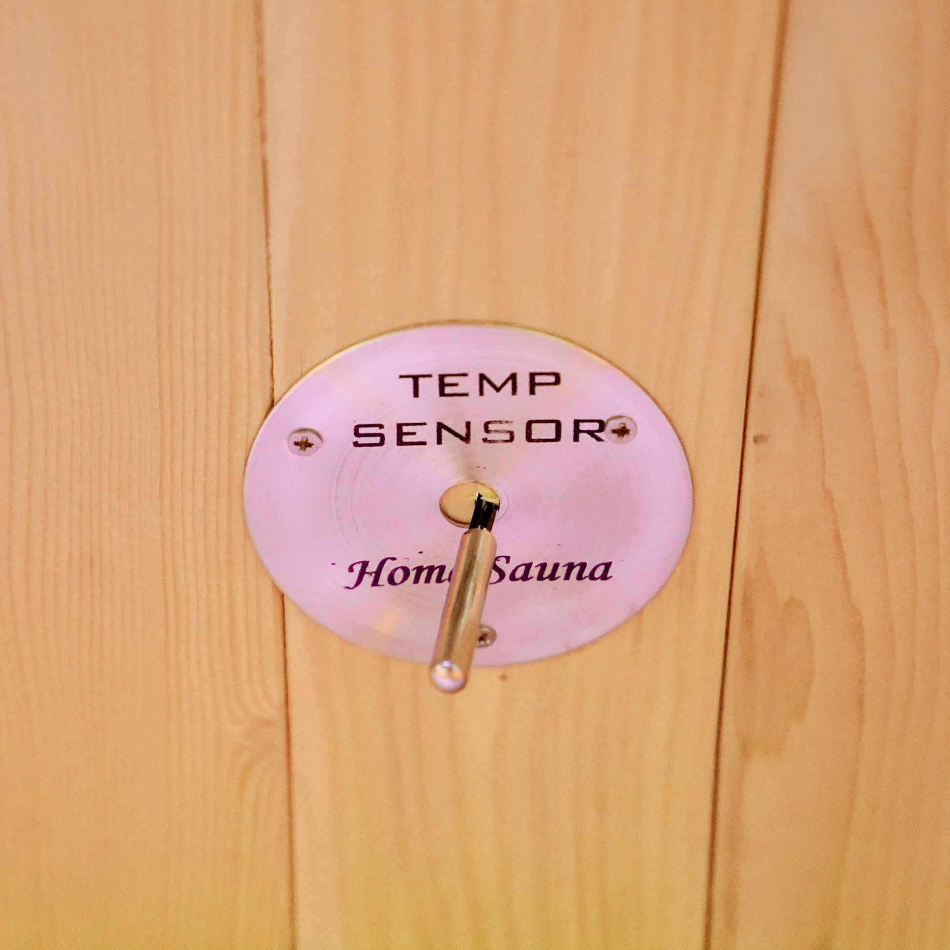 Temperature sensor mounted on a wooden wall