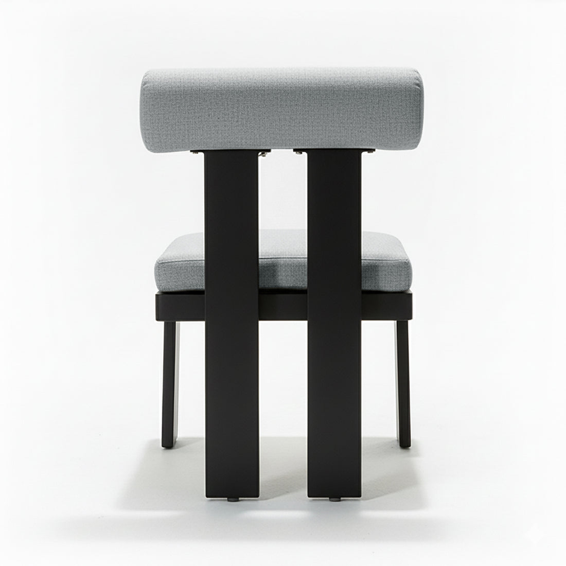 Positano 6 Seater Outdoor Dining Set in Black & Grey features a minimalist chair with light-gray upholstered seat and backrest on a sleek black metal frame, emphasizing modern design.