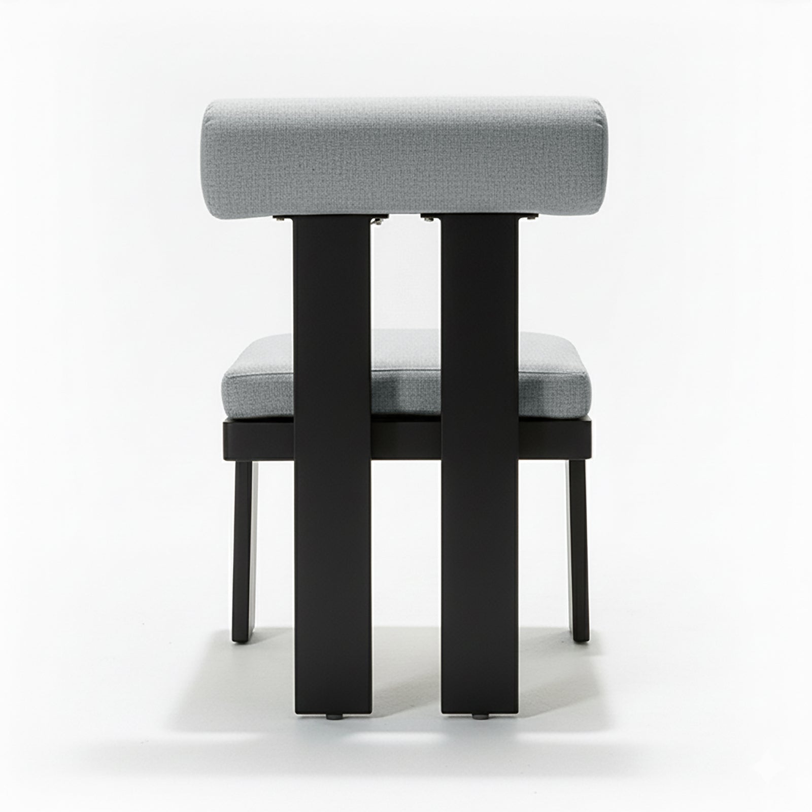 Positano 6 Seater Outdoor Dining Set in Black & Grey features a minimalist chair with light-gray upholstered seat and backrest on a sleek black metal frame, emphasizing modern design.