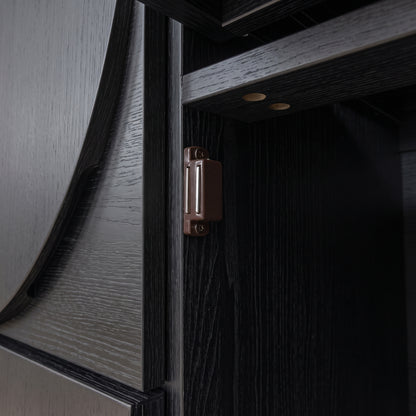 Extreme close-up of a hinge on dark wood furniture