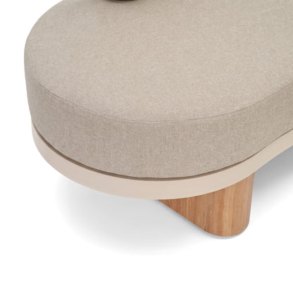 Close-up of beige upholstered furniture with a wooden leg on a white background