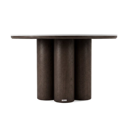 Round dark wood table with cylindrical base on a white background